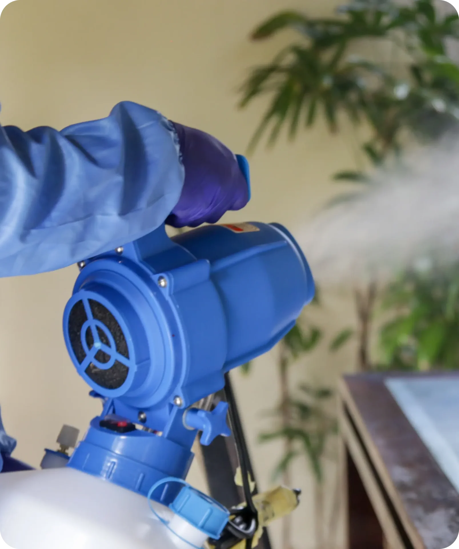 A person spraying water from an industrial device.